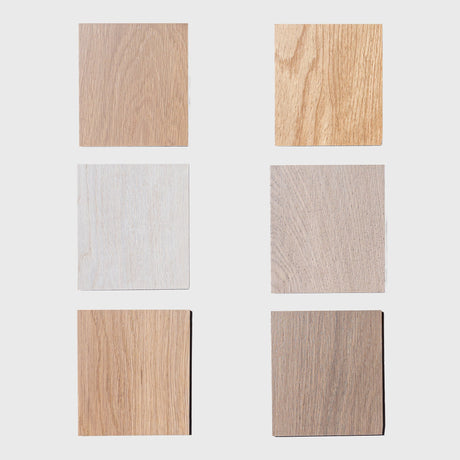 Six white oak wood square samples of different wood finishes on a white background